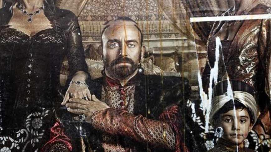 A billboard advertising the TV series "The Magnificent Century" is seen after being damaged by eggs thrown by pro-Islamic protesters in Istanbul January 9, 2011. Turkish protesters angry over the depiction of an Ottoman sultan drinking alcohol and wooing women in a new television series threw eggs and chanted "God is Great" outside of the broadcaster's studio on Sunday. A group of about 100 protesters, accompanied by a band playing Ottoman military music, marched to the offices of the entertainment channel