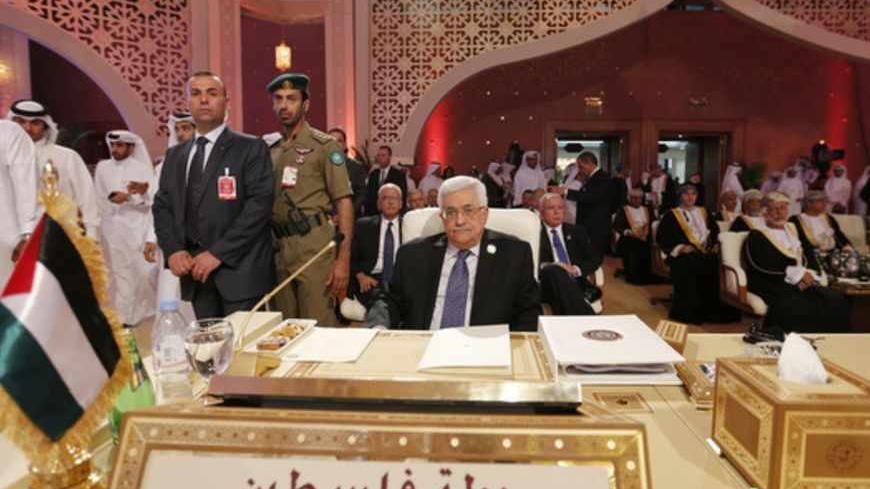 Palestinian President Mahmoud Abbas looks on during the opening of the Arab League summit in Doha, Qatar, March 26, 2013. A summit of Arab heads of state opened in the Qatari capital Doha on Tuesday expected to focus on the war in Syria as well as on the Israeli-Palestinian conflict. REUTERS/Ahmed Jadallah (QATAR - Tags: POLITICS) - RTXXXPW