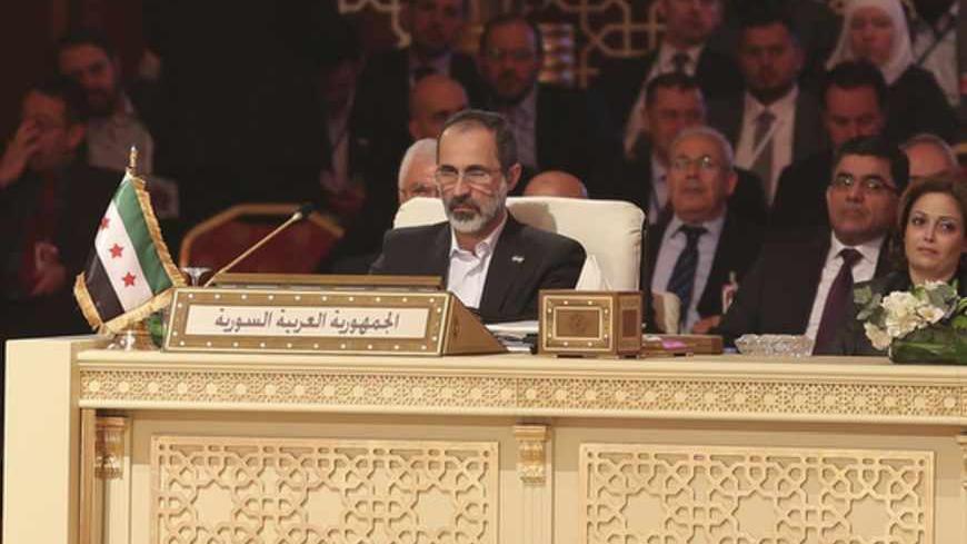 Moaz Alkhatib, head of the Syrian National Coalition, attends the Arab League summit in Doha in this March 26, 2013 handout. A summit of Arab heads of state opened in the Qatari capital Doha on Tuesday expected to focus on the war in Syria as well as on the Israeli-Palestinian conflict. REUTERS/Handout (QATAR - Tags: POLITICS) ATTENTION EDITORS - FOR EDITORIAL USE ONLY. NOT FOR SALE FOR MARKETING OR ADVERTISING CAMPAIGNS. THIS IMAGE HAS BEEN SUPPLIED BY A THIRD PARTY. IT IS DISTRIBUTED, EXACTLY AS RECEIVED 