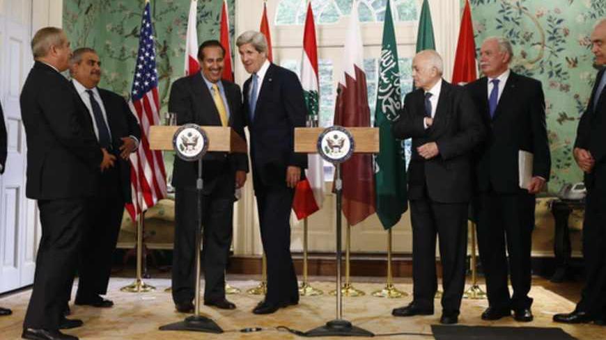 U.S. Secretary of State John Kerry (4th R) and Qatar's Prime Minister Sheikh Hamad bin Jassim al-Thani (4th L) shake hands after speaking to the media following their meeting with members of the Arab League at Blair House in Washington April 29, 2013. With them are (L-R) Saudi Ambassador to the United States Adel A-Jubeir, Jordan's Foreign Minister Nasser Judeh, Bahrain's Foreign Minister Sheikh Khalid bin Ahmed al Khalifa, Arab League Secretary General Nabil al-Araby, Palestinian Authority Foreign Minister