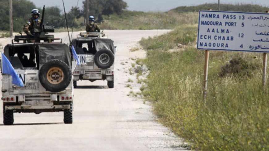 U.N. peacekeepers serving with the United Nations Interim Force in Lebanon (UNIFIL)patrol on their vehicles at the area near the border between Lebanon and Israel in Naqoura, southern Lebanon, May 5, 2013. REUTERS/Ali Hashisho (LEBANON - Tags: POLITICS MILITARY) - RTXZAZW