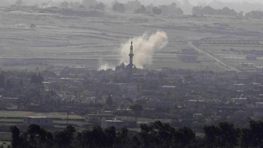 Smoke rises after shells exploded in the Syrian village of Al Rafeed, close to the ceasefire line between Israel and Syria, as seen from the Israeli occupied Golan Heights May 7, 2013. Israel played down weekend air strikes close to Damascus reported to have killed dozens of Syrian soldiers, saying they were not aimed at influencing its neighbour's civil war but only at stopping Iranian missiles reaching Lebanese Hezbollah militants. REUTERS/Baz Ratner (SYRIA - Tags: POLITICS MILITARY) - RTXZDAV