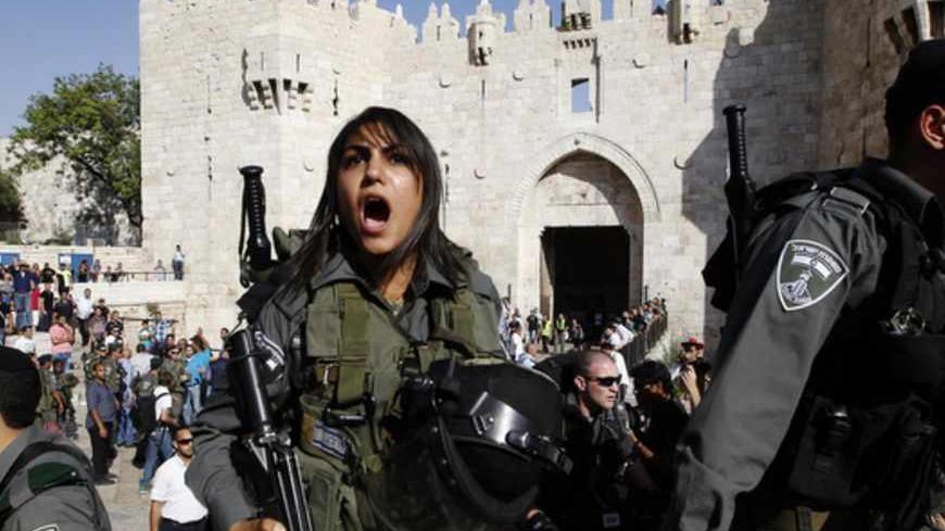 Israeli border police officers guard the front of Damascus Gate outside Jerusalem's Old City during a parade marking Jerusalem Day May 8, 2013. Jerusalem Day marks the anniversary of Israel's capture of the Eastern part of the city during the 1967 Middle East War. In 1980, Israel's parliament passed a law declaring united Jerusalem as the national capital, a move never recognised internationally. There were confrontations on Wednesday between Muslims and Jews outside Jerusalem's walled Old City, where al-Aq