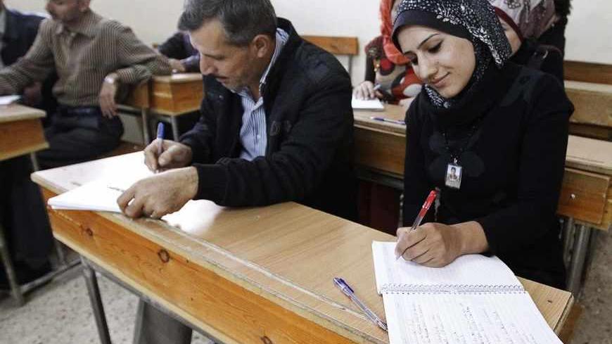 Syrian Kurds practise reading the Kurdish language at a school in Derik, Al-Hasakah October 31, 2012. Iraqi Kurdish President Masoud Barzani warned Kurds in Syria against being sucked into the "fires of discord," urging them to preserve Kurdish unity as tensions between rival factions threaten to spillover into violence. Syria's Kurds see the war ravaging their country as an unprecedented opportunity to gain the kind of freedoms enjoyed by their ethnic kin in neighbouring Iraq, where they live autonomously 