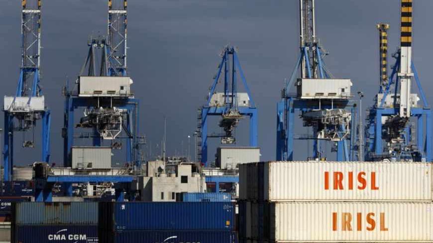 Empty and disused Islamic Republic of Iran Shipping Lines (IRISL Group) containers are seen at Malta Freeport in the Port of Marsaxlokk outside Valletta February 10, 2012.  The IRISL ships and containers are key parts in an international cat-and-mouse game: Iran's attempt to evade the trade sanctions tightening around it. Washington and European capitals want to stop or slow Iran's nuclear programme. They believe that IRISL, which moves nearly a third of Iran's exports and imports and is central to the coun