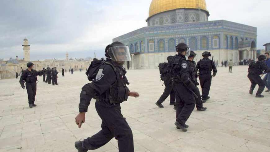 Israeli border police run in front of Dome of the Rock during a protest after Friday prayers at a compound known to Muslims as al-Haram al-Sharif and to Jews as Temple Mount, in Jerusalem's Old City February 22, 2013. Palestinian protesters have said they fear for the life of Samer al-Issawi, who has been on intermittent hunger strike for over 200 days, and three other hunger strikers jailed by Israel. Their cases have been at the centre of intensified clashes with Israeli soldiers throughout the Israeli-oc