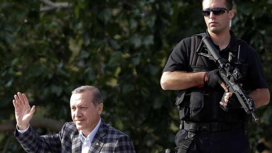 Turkey's Prime Minister Tayyip Erdogan addresses his supporters in Ankara June 9, 2013. Erdogan stands before a sea of cheering faithful waving Turkish flags and, to shouts of "Allahu Akbar", God is Greatest, summons the spirit of pious Ottoman poets in denouncing protesters who challenge his power. Across Istanbul, the same flags, white crescent moon and star on a red background, are raised; but they proclaim what some Erdogan critics see as a different kind of Turkey. Riots and protests have highlighted a