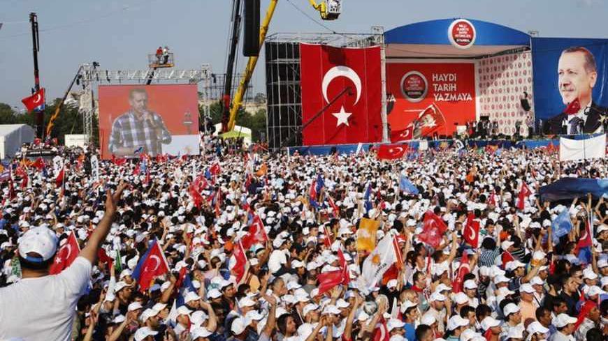 Turkish Prime Minister Tayyip Erdogan addresses his supporters during a rally by his ruling AK Party in Istanbul June 16, 2013. Erdogan rallied hundreds of thousands of supporters at an Istanbul parade ground on Sunday as riot police fired teargas several kilometres away in the city centre to disperse anti-government protesters. REUTERS/Murad Sezer (TURKEY  - Tags: POLITICS CIVIL UNREST) - RTX10PZS