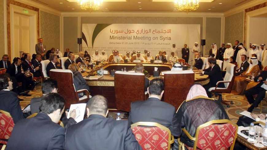 Qatari Prime Minister and Foreign Minister Sheikh Hamad bin Jassim al-Thani (C) speaks during the London 11 countries "Friends of Syria" meeting in Doha June 22, 2013. Western and Arab opponents of Bashar al-Assad met in Qatar on Saturday to tighten coordination of their stepped up support for rebels battling to overthrow the Syrian president. REUTERS/Mohammed Dabbous (QATAR - Tags: POLITICS CONFLICT) - RTX10WYN