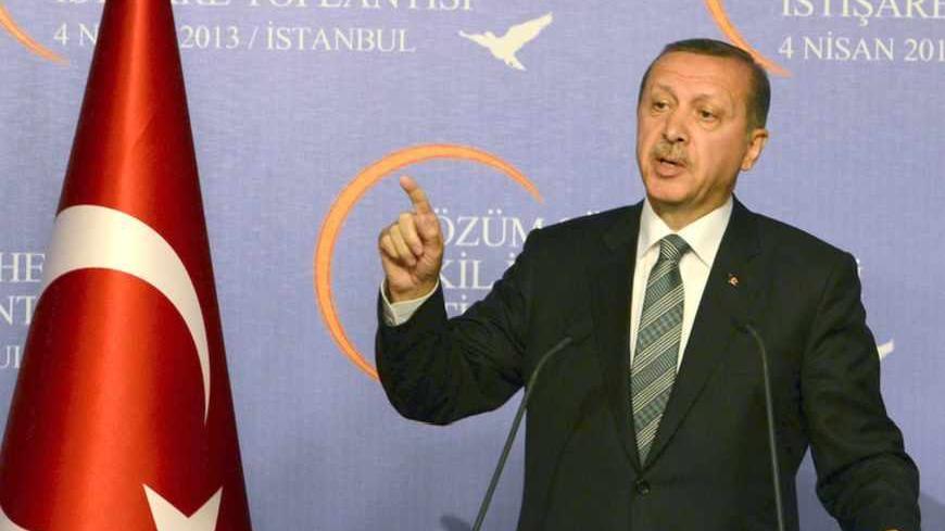 Turkey's Prime Minister Tayyip Erdogan makes his address during a meeting with the 'wise people' commission in Istanbul April 4, 2013. Erdogan chaired an inaugural meeting of the 'wise people' commission, who will be consulted on a peace process with Kurdish militants. The commission is made up of academics, journalists and performing artists, and established by the government to promote the peace process nationwide. REUTERS/Metin Pala/Pool (TURKEY - Tags: POLITICS CIVIL UNREST) - RTXY8EB