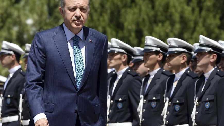 Turkey's Prime Minister Tayyip Erdogan reviews students of the Police Academy upon his arrival to their graduation ceremony in Ankara June 24, 2013. REUTERS/Stringer (TURKEY - Tags: POLITICS CRIME LAW) - RTX10YXL