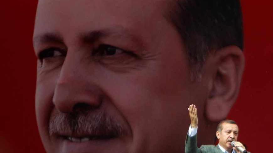 Turkey's Prime Minister Tayyip Erdogan speaks during a rally in Sincan June 15, 2013. Erdogan warned protesters occupying a central Istanbul park that they should leave before a ruling party rally on Sunday or face eviction by the security forces. REUTERS/Dado Ruvic (TURKEY - Tags: POLITICS CIVIL UNREST) - RTX10ORO