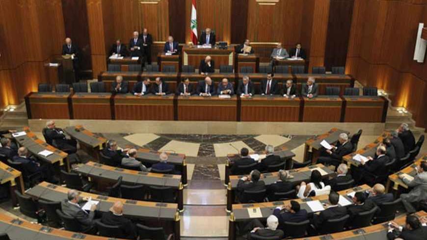 Lebanese members of parliament attend a session in Beirut, May 31, 2013. Lebanese lawmakers agreed on Friday to postpone a June parliamentary election until late next year due to instability in neighbouring Syria and political deadlock at home. REUTERS/Mohamed Azakir (LEBANON - Tags: POLITICS ELECTIONS) - RTX1073U
