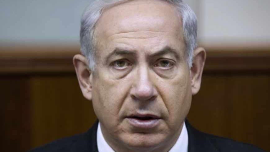 Israel's Prime Minister Benjamin Netanyahu attends the weekly cabinet meeting in Jerusalem June 16, 2013. Netanyahu called on Sunday for no let-up in international pressure on Iran to curb its nuclear ambitions after the election of a new president widely seen as a moderate. REUTERS/Uriel Sinai/Pool (JERUSALEM - Tags: POLITICS) - RTX10PJ1