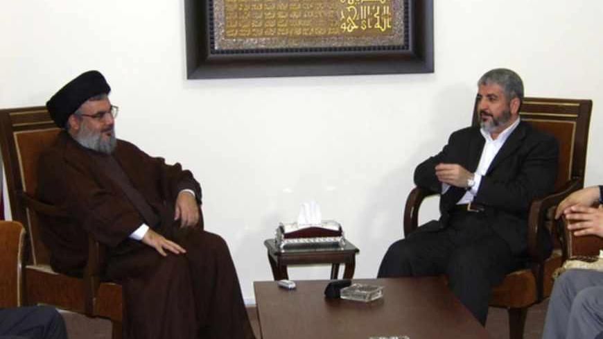 Lebanon's Hezbollah Leader Sayyed Hassan Nasrallah (center, L) meets with Hamas leader Khaled Meshaal (center, R) in Beirut in this photo released in July 12, 2010. Hamas leader Meshaal visited Lebanon to pay his condolences for Grand Ayatollah Sayyed Mohammed Hussein Fadlallah who died last week. REUTERS/Lebanon's Hezbollah Media office/Handout    (LEBANON - Tags: POLITICS OBITUARY) FOR EDITORIAL USE ONLY. NOT FOR SALE FOR MARKETING OR ADVERTISING CAMPAIGNS - RTR2GCPX