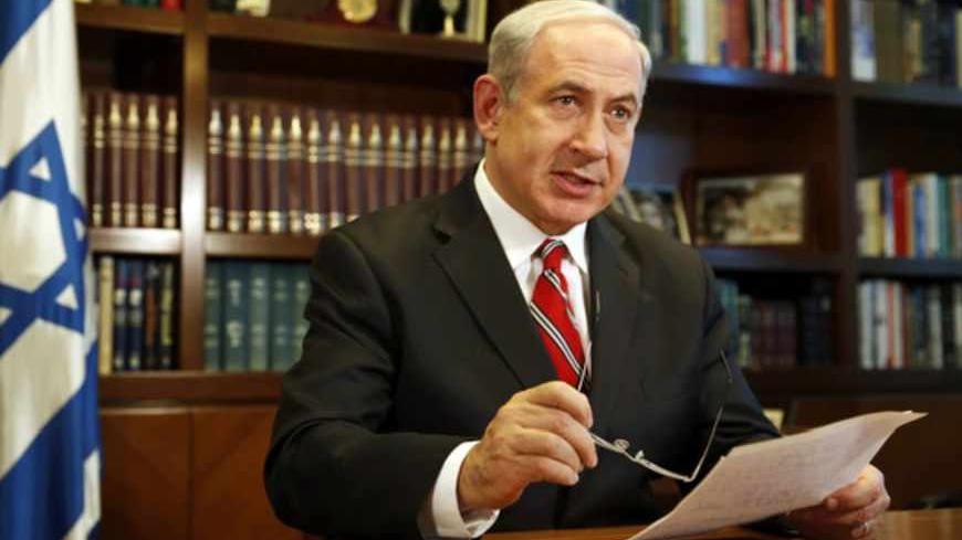 Israeli Prime Minister Benjamin Netanyahu gestures as he speaks during an interview with Reuters in Jerusalem June 17, 2013.  Iran's election has exposed popular discontent with the Tehran government but was unlikely to bring about any change in Iranian nuclear policy, Netanyahu told Reuters on Monday.  REUTERS/Darren Whiteside (JERUSALEM - Tags: POLITICS HEADSHOT) - RTX10R1H