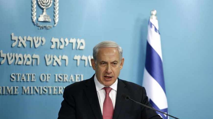 Israel's Prime Minister Benjamin Netanyahu speaks during a joint news conference with Bank of Israel Governor Stanley Fischer, Energy Minister Silvan Shalom and Finance Minister Yair Lapid (not pictured) in Jerusalem June 19, 2013. Israel said on Wednesday it will keep the majority of it's newfound natural gas for domestic use, but will still allow enough gas to be sold abroad to satisfy exploration companies who want access to the global market. REUTERS/Baz Ratner (JERUSALEM - Tags: POLITICS ENERGY BUSINES