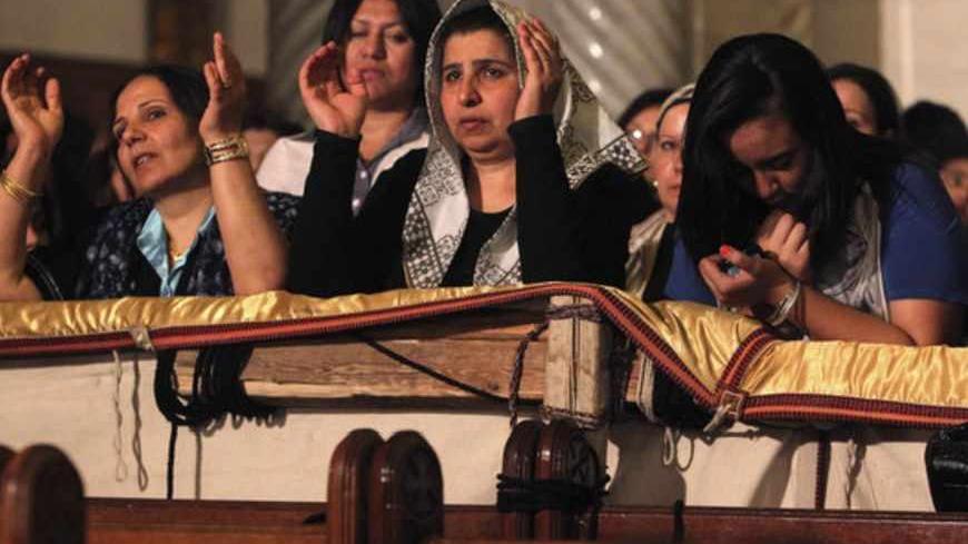 Coptic Christians pray during a Coptic Orthodox Easter mass at the main cathedral in Cairo May 4, 2013. REUTERS/Asmaa Waguih (EGYPT - Tags: RELIGION) - RTXZAOM