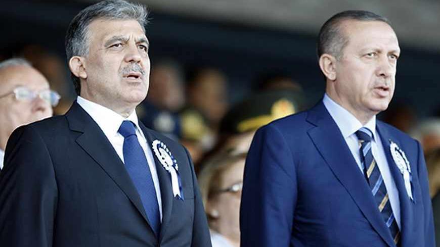Turkey's President Abdullah Gul (L) and Turkey's Prime Minister Recep Tayyip Erdogan attend a graduation ceremony for 226 cadets at the Air Force war academy in Istanbul August 30, 2011. REUTERS/Osman Orsal (TURKEY - Tags: MILITARY EDUCATION) - RTR2QJGQ
