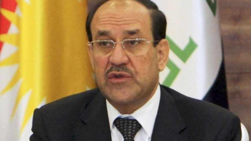 Iraqi Prime Minister Nuri al-Maliki (R) speaks next to his Iraqi Kurdish counterpart Nechirvan Barzani during a meeting of the Council of Ministers in Arbil, about 350 km (220 miles) north of Baghdad June 9, 2013. Maliki visited the Kurdistan region on Sunday for the first time in more than two years, in an attempt to resolve a long-running dispute over oil and land that has strained Iraq's unity to the limit. REUTERS/Azad Lashkari (IRAQ - Tags: POLITICS) - RTX10H5T