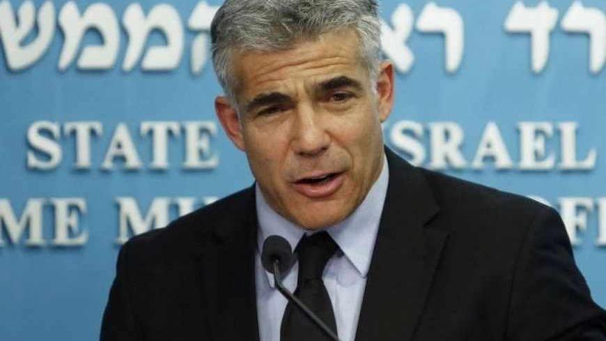 Israel's Finance Minister Yair Lapid speaks during a joint news conference with Prime Minister Benjamin Netanyahu, Bank of Israel Governor Stanley Fischer, Energy Minister Silvan Shalom and  (not pirctured) in Jerusalem June 19, 2013. Israel said on Wednesday it will keep the majority of it's newfound natural gas for domestic use, but will still allow enough gas to be sold abroad to satisfy exploration companies who want access to the global market. REUTERS/Baz Ratner (JERUSALEM - Tags: POLITICS ENERGY BUSI