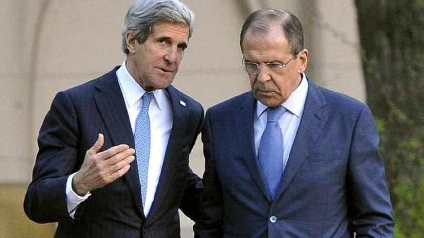 Russia's Foreign Minister Sergei Lavrov (R) and U.S. Secretary of State John Kerry talk during their meeting in Moscow, May 7, 2013. Russia and the United States agreed on Tuesday to try to arrange an international conference this month on ending the civil war in Syria, and said both sides in the conflict should take part. REUTERS/Mladen Antonov/Pool (RUSSIA - Tags: POLITICS CONFLICT) - RTXZE30