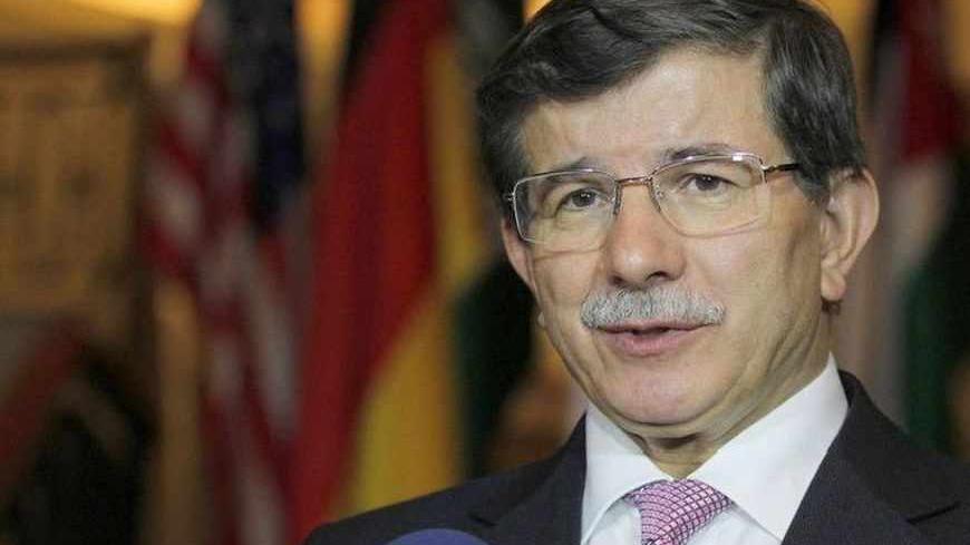 Turkish Foreign Minister Ahmet Davutoglu speaks to the media after the Friends of Syria alliance meeting in Amman May 22, 2013. REUTERS/Muhammad Hamed (JORDAN - Tags: POLITICS) - RTXZX4H