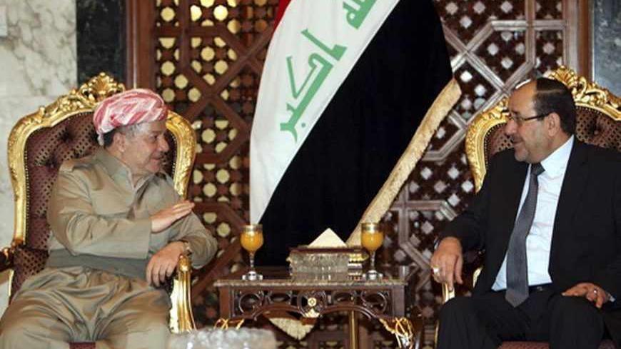 Iraqi Prime Minister Nuri al-Maliki (R) meets with Iraqi Kurdish President Masoud Barzani (L) in Baghdad, July 7, 2013. Barzani visited Baghdad on Sunday for the first time in more than two years, in a symbolic step to resolve disputes between the central government and the autonomous region over land and oil. The visit follows an equally rare trip by Iraqi Prime Minister Nuri al-Maliki who met Barzani in Kurdistan last month, breaking ice between leaders who have repeatedly accused each other of violating
