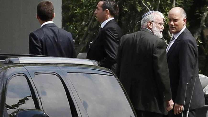 An Israeli delegation arrives at the Turkish Foreign Ministry to hold talks on compensation for families of victims killed in a 2010 naval raid on Turkish-led humanitarian-aid convoy to Gaza, in Ankara April 22, 2013. REUTERS/Umit Bektas (TURKEY - Tags: POLITICS) - RTXYVKG