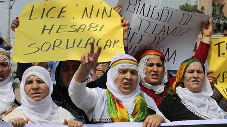Protesters shout slogans during a demonstration against Turkish security forces, after an incident in the Lice district of Diyarbakir province killed one person and wounded seven on Friday, in Istanbul June 29, 2013. Turkish security forces killed one person and wounded seven on Friday when they fired on a group of people protesting against construction of a new gendarmerie outpost in Kurdish-dominated southeastern Turkey, security sources said. The incident happened in the village of Kayacik in the Lice di