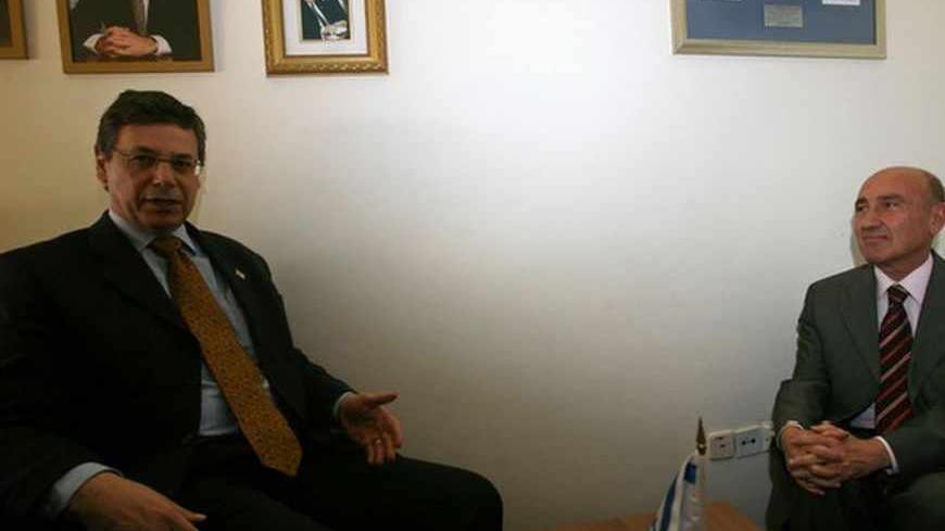 Israel's Deputy Foreign Minister Danny Ayalon (L) meets Turkey's ambassador to Israel Ahmet Oguz Celikkol at the Knesset, the Israeli parliament, in Jerusalem January 11, 2010. Israel issued a strong condemnation of Turkish Prime Minister Tayyip Erdogan on Monday, saying his often fierce public criticism of its policies could undermine relations. Israeli Defence Minister Ehud Barak will pay a one-day visit to Turkey on Sunday, Turkish and Israeli officials said, a trip that could help mend frayed ties betwe