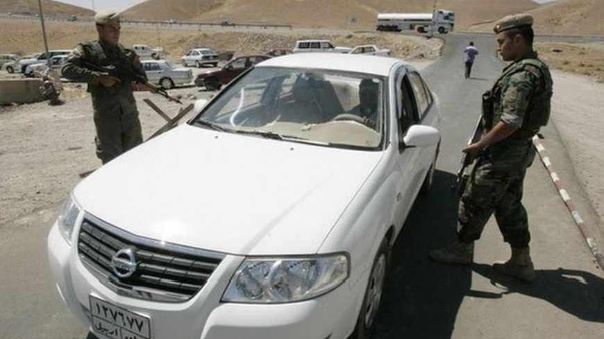 Kurdish Peshmerga soldiers man a checkpoint in Kirkuk, 250 km (155 miles) north of Baghdad June 29, 2011. Iraq's Kurds may be split on everything from party politics to how to manage their region's oil wealth, but most agree on one thing: They need U.S. troops to stay to help preserve the peace. More than eight years after the U.S. invasion, Iraqis are debating whether to ask American troops to stay on past a planned withdrawal, a sensitive question that is testing its fragile power-sharing government. Kurd