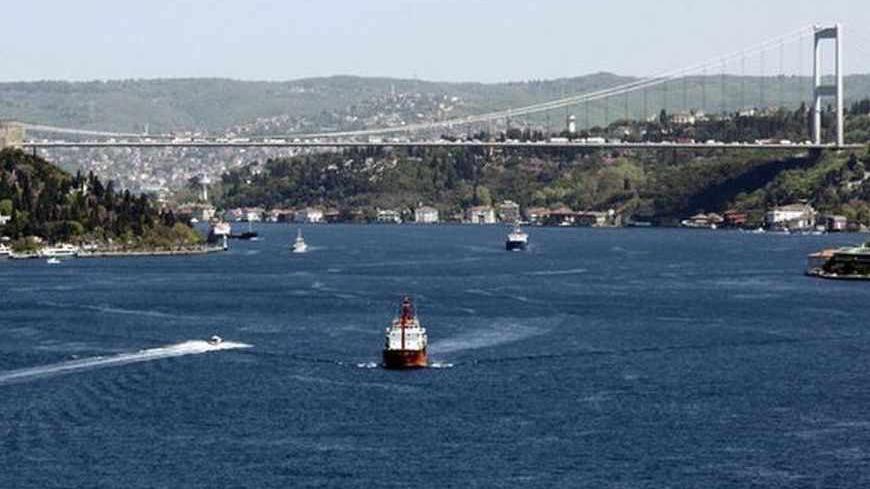 Oil tankers sail under the Fatih Sultan Mehmet Bridge linking the city's European and Asian sides, over the Bosphorus waterway in Istanbul April 26, 2012.  REUTERS/Osman Orsal (TURKEY - Tags: ENERGY POLITICS BUSINESS MARITIME ENVIRONMENT) - RTR318MG