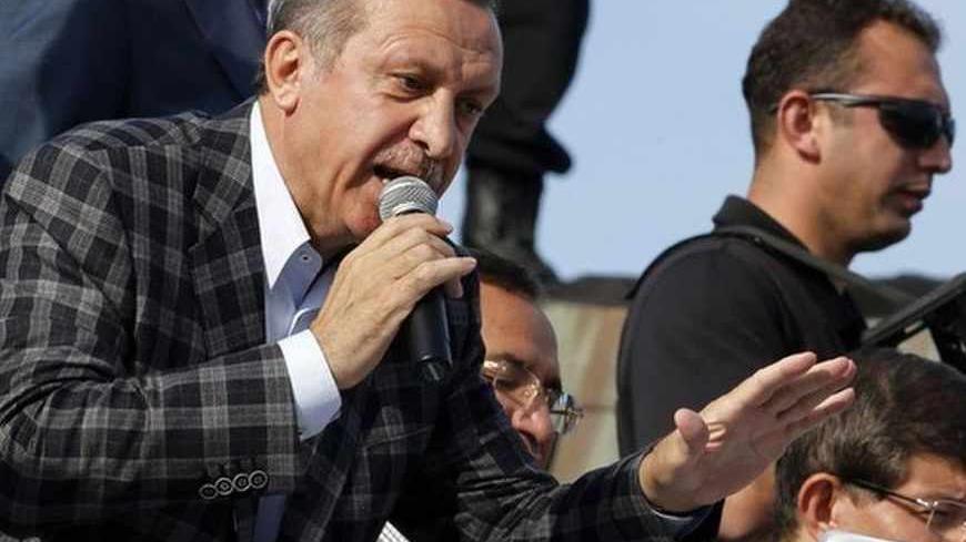 Turkey's Prime Minister Tayyip Erdogan addresses his supporters in Ankara June 9, 2013.  Still by far the country's most popular politician, Erdogan has pressed ahead with government business as usual. REUTERS/Umit BEKTAS (TURKEY - Tags: POLITICS) - RTX10HTJ