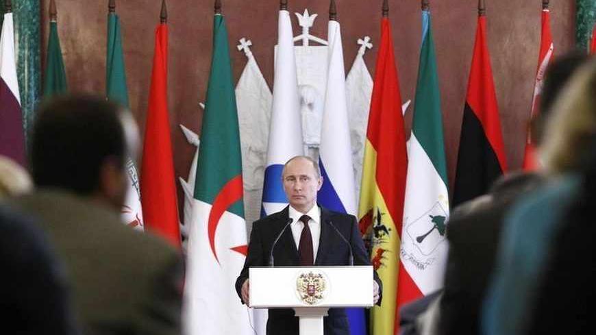 Russia's President Vladimir Putin attends a news conference, part of the Gas Exporting Countries Forum (GECF), at the Kremlin in Moscow, July 1, 2013. Putin said on Monday that Russia would not hand former U.S. spy agency contractor Edward Snowden over to the United States but that if Snowden wants to stay in Russia he "must stop his work aimed at harming our American partners". REUTERS/Maxim Shemetov (RUSSIA - Tags: POLITICS ENERGY BUSINESS) - RTX118XS