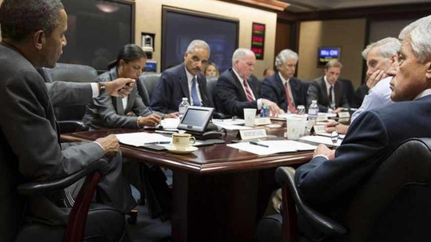 President Barack Obama (L) meets with members of his national security team to discuss the situation in Egypt, in the Situation Room of the White House in Washington July 3, 2013. REUTERS/Pete Souza/White House/Handout via Reuters (UNITED STATES - Tags: POLITICS CIVIL UNREST) FOR EDITORIAL USE ONLY. NOT FOR SALE FOR MARKETING OR ADVERTISING CAMPAIGNS. THIS IMAGE HAS BEEN SUPPLIED BY A THIRD PARTY. IT IS DISTRIBUTED, EXACTLY AS RECEIVED BY REUTERS, AS A SERVICE TO CLIENTS - RTX11BT1