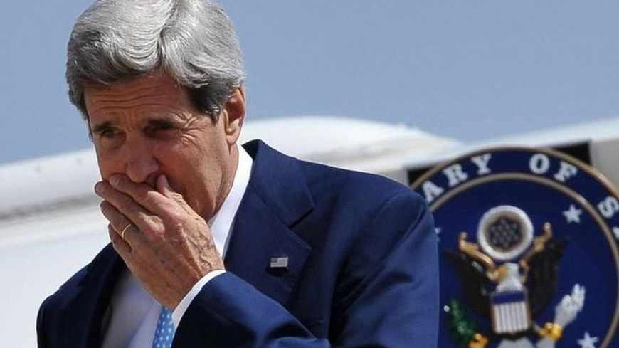U.S. Secretary of State John Kerry steps off his plane upon his arrival at Queen Alia International Airport in Amman, July 16, 2013. Kerry will discuss his effort to revive Israeli-Palestinian peace talks with Arab officials in Jordan on Wednesday, according to the State Department, which declined to comment on whether a resumption may be at hand. REUTERS/Mandel Ngan/Pool (JORDAN - Tags: POLITICS) - RTX11OB2