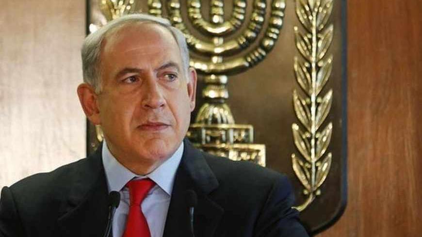 Israeli Prime Minister Benjamin Netanyahu delivers a statement to the media at the Knesset, Israeli parliament, in Jerusalem July 22, 2013. Netanyahu will seek formal cabinet backing for reviving U.S.-sponsored peace talks with the Palestinians, an Israeli official said, after pro-settler ministers threatened to try and thwart the initiative. REUTERS/Baz Ratner (JERUSALEM - Tags: POLITICS) - RTX11V51