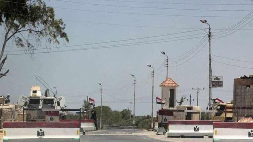 An army check point is seen in El-Arish city, in North Sinai July 15, 2013. At least three people were killed and 17 wounded when suspected militants fired rocket-propelled grenades at a bus carrying workers in Egypt's North Sinai province early on Monday, security and medical sources said. REUTERS/Stringer (EGYPT - Tags: CIVIL UNREST POLITICS MILITARY) - RTX11NAD