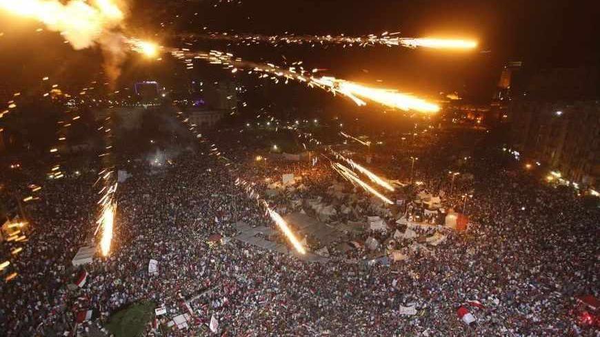 Protesters demand that Egyptian President Mohamed Mursi resign at Tahrir Square in Cairo July 1, 2013. Egypt's armed forces handed Islamist President Mohamed Mursi a virtual ultimatum to share power on Monday, giving feuding politicians 48 hours to compromise or have the army impose its own roadmap for the country. REUTERS/Mohamed Abd El Ghany (EGYPT  - Tags: POLITICS CIVIL UNREST) - RTX119C3