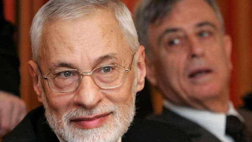 Syrian Muslim Brotherhood secretary-general Ali Saad-al-din Bayanouni (L) and former Syrian Vice-President Abdel-Halim Khaddam hold a news conference in Brussels March 17, 2006. Exiled Syrian opposition leaders announced the creation of a united front on Friday aimed at forming a transitional government to bring about "regime change" from President Bashar al-Assad to democracy.    REUTERS/Francois Lenoir - RTR17B3V