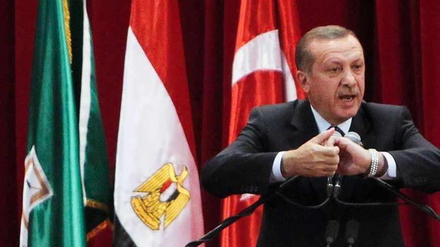 Turkish Prime Minister Tayyip Erdogan delivers a speech at Cairo University after his meeting with the Egyptian President Mohamed Mursi during the first day of his two-day trip to Egypt, November 17, 2012. Erdogan, an outspoken of critic of Israel, praised Egypt's Islamist president Mursi on Saturday for recalling his ambassador from Tel Aviv in response to Israeli attacks on Gaza. REUTERS/Asmaa Waguih (EGYPT - Tags: POLITICS TPX IMAGES OF THE DAY) - RTR3AJ7X