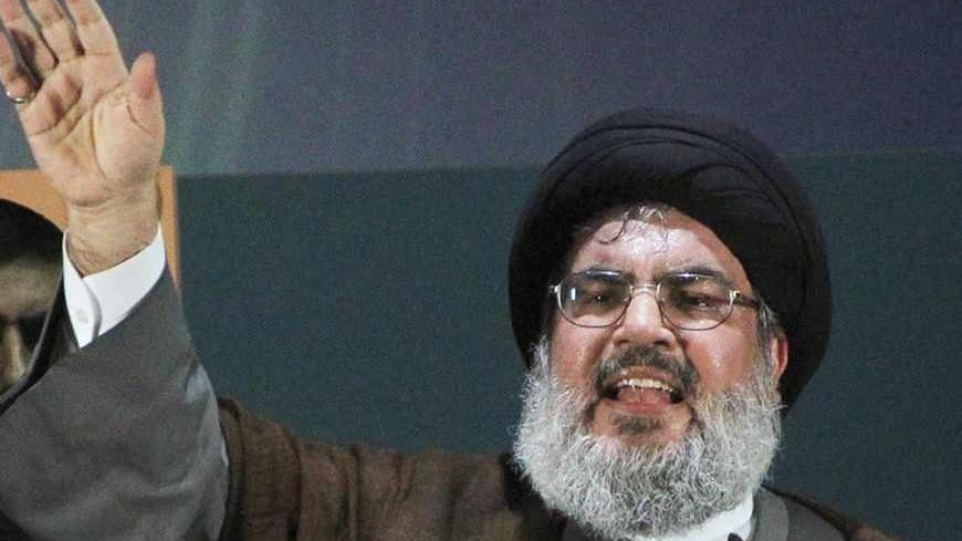 Lebanon's Hezbollah leader Sayyed Hassan Nasrallah makes a rare public appearance as he addresses his supporters during a rally to mark Quds (Jerusalem) Day in Beirut's southern suburbs, August 2, 2013. Nasrallah delivered a speech to hundreds of supporters in support of Palestinians in his first public appearance since last September. He has been living in hiding, for fear of assassination, since Hezbollah fought a month-long war with Israel in 2006. REUTERS/Sharif Karim   (LEBANON - Tags: POLITICS CIVIL U