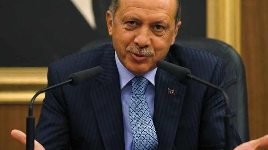 Turkey's Prime Minister Tayyip Erdogan gestures as he addresses the media before leaving for Turkmenistan at Esenboga Airport in Ankara August 15, 2013. Erdogan called on Thursday for the U.N. Security Council to convene quickly and act after what he described as a massacre in Egypt, during a news conference in Ankara. REUTERS/Umit Bektas (TURKEY - Tags: POLITICS) - RTX12M4D