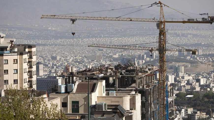 EDITORS' NOTE: Reuters and other foreign media are subject to Iranian restrictions on their ability to report, film or take pictures in Tehran. 

Construction cranes work on a high rise buildings in the foothills of the Alborz mountains in north Tehran April 15, 2010. President Mahmoud Ahmadinejad has asked 5 million Tehranis to evacuate the capital since they know their sprawling metropolis is due for a massive earthquake. When the last major earthquake hit, in 1831, Tehran was tiny compared to the metro