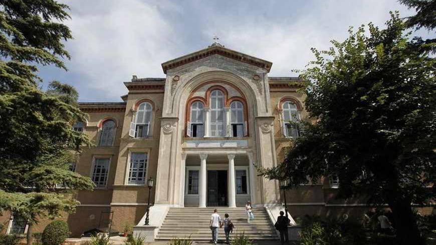 Visitors leave the "Tracing Istanbul", an exhibition of works by Greek artists, at the Greek Orthodox seminary in Heybeliada island near Istanbul September 4, 2010. An Istanbul seminary closed in 1971 is hosting its first public event in 40 years, raising hopes it may shortly be reopened by Turkey and once again educate priests for the Greek Orthodox community. The European Union and the United States have pressed EU membership hopeful Turkey to reopen the historic school, which occupies a beautiful and com