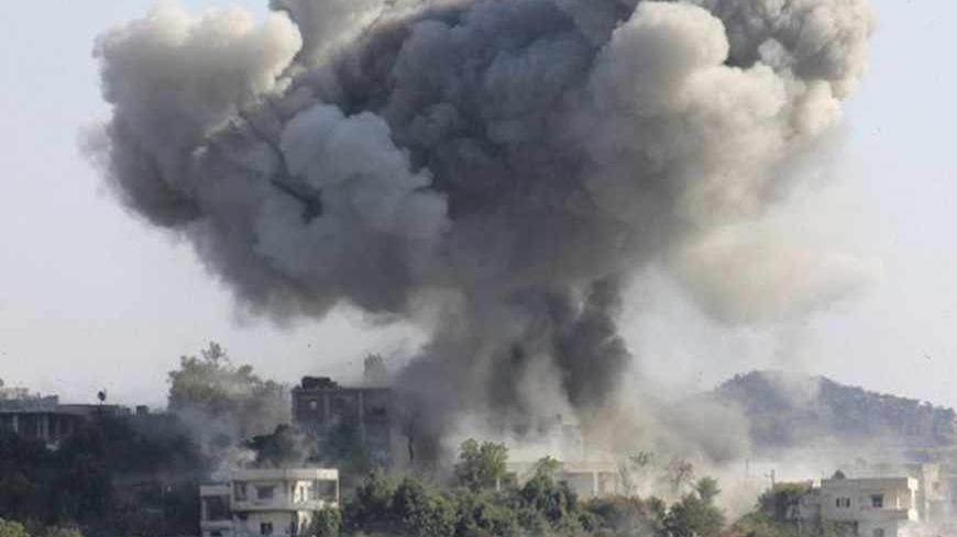 Smoke rises after what activists said was shelling by forces loyal to Syria's President Bashar al-Assad in the village of Dourit, in Latakia countryside August 17, 2013. Picture taken August 17, 2013. REUTERS/Khattab Abdulaa (SYRIA - Tags: POLITICS CIVIL UNREST TPX IMAGES OF THE DAY) - RTX12PMS