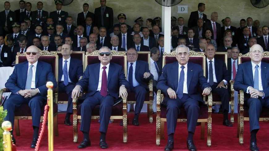 Lebanon's President Michel Suleiman (C), Lebanon's Parliament Speaker Nabih Berri, Prime Minister-designate Tammam Salam (L) and Lebanon's caretaker Prime Minister Najib Mikati (R) attend a graduation parade for Lebanese officer cadets at a military academy in Fayadyeh, near Beirut, marking the 68th Army Day, August 1, 2013. REUTERS/Sharif Karim (LEBANON - Tags: POLITICS ANNIVERSARY MILITARY) - RTX126UK