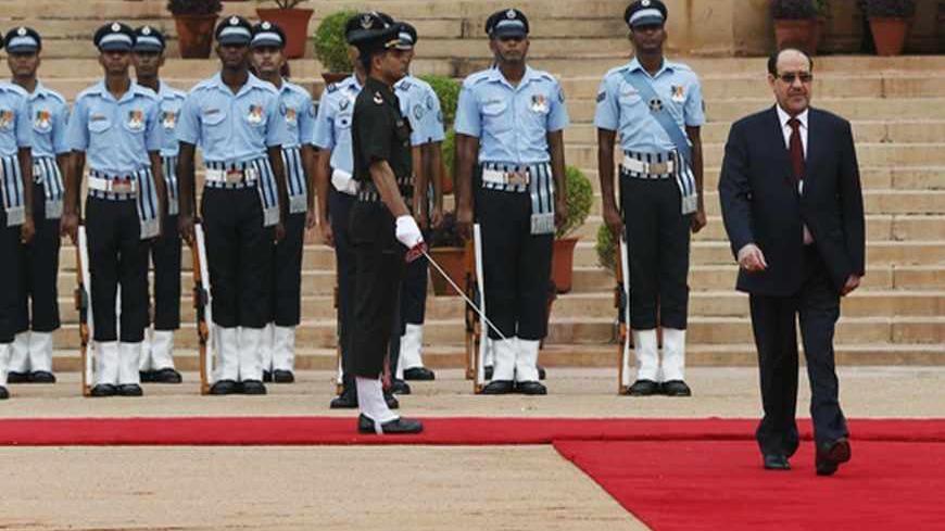 Iraqi Prime Minister Nuri al-Maliki inspects a guard of honour during his ceremonial reception at the forecourt of India's presidential palace Rashtrapati Bhavan in New Delhi August 23, 2013. Maliki expects to finalise a deal to sell India more crude oil during a visit to New Delhi over the next few days, he said on Thursday. REUTERS/Adnan Abidi (INDIA - Tags: POLITICS BUSINESS ENERGY COMMODITIES) - RTX12TX2