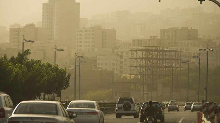 EDITORS' NOTE: Reuters and other foreign media are subject to Iranian restrictions on their ability to film or take pictures in Tehran.
Motorists travel on a highway in Tehran as the city is covered in dust July 6, 2009. The government closed private educational centres, state offices, industrial units and military bases for two days and raised its pollution alert status due to the dust, which an official from Tehran's environment office attributed the source to dust from dried marshland in Iraq blown towa